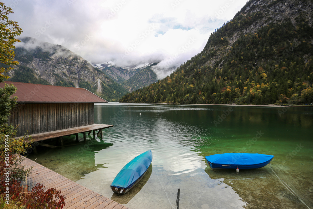 Fall at lake Plansee with turquoise water in recreational silence

