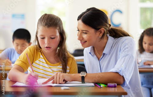 Teacher, learning and helping girl in classroom for writing, studying or assessment. Teaching, development and kid or student with happy woman for education assistance with notebook in kindergarten.