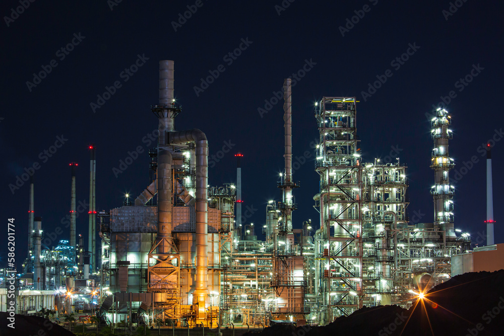 Night scene of oil refinery plant and tower column of Petrochemistry industry site construction