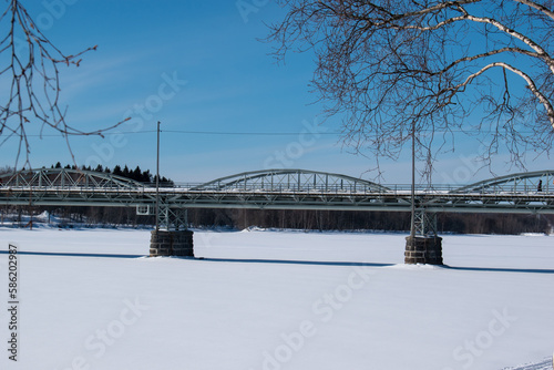 UMEA SWEDEN 26 MARCH 2023. The Umea River on a sunny clear Winter day. photo