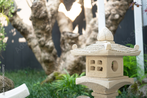 Canvas Print A classic design of Japanese lighting lamp that made from stone material, using for decorate the garden