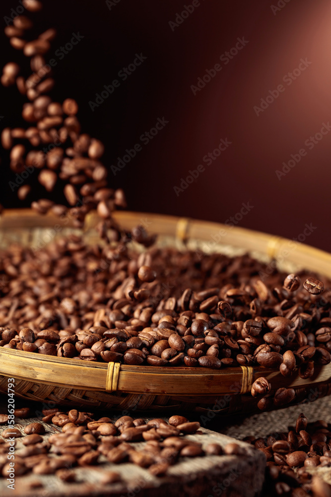 Fototapeta premium Medium-roasted coffee beans are poured into a basket.