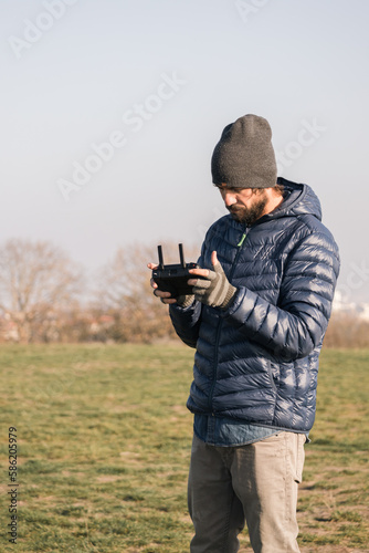 Drone pilot holding and look at remote control