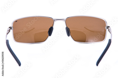 Fashion sunglasses silver frame and brown lens on white background. photo