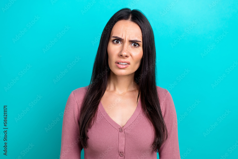 Fototapeta premium Portrait of unsatisfied confused person look questioned isolated on emerald color background