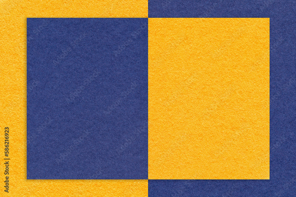 Texture of yellow and navy blue paper background with pattern, macro. Craft golden and denim cardboard Texture of yellow and navy blue paper background with pattern, macro. Craft golden and denim cardboard