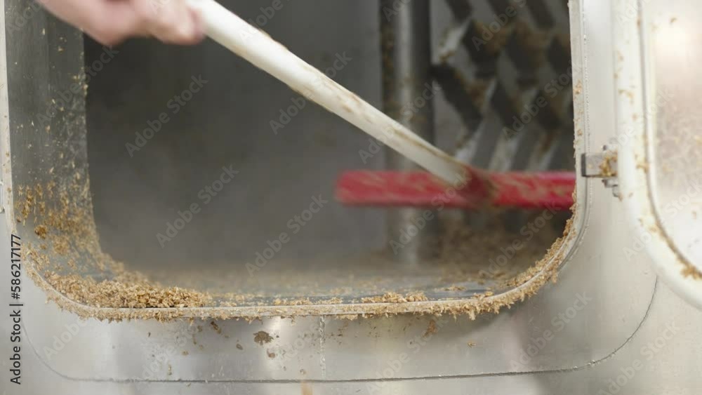 cleaning the tank with residual malt after brewing beer in a brewery