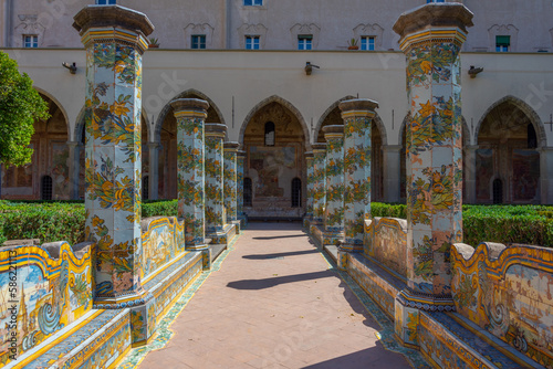 Colorful columns at the cloister of Santa Chiara in Naples, Italy photo