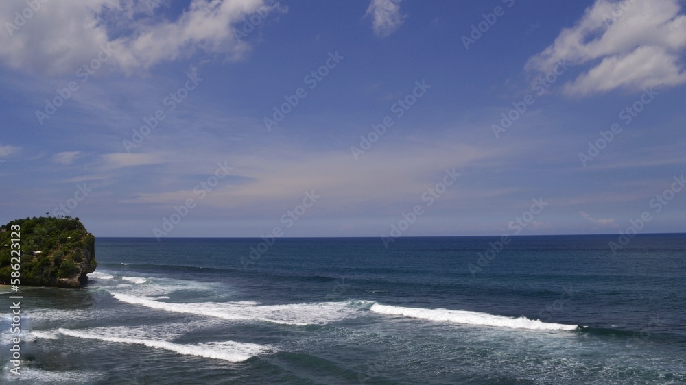 Blue ocean wave on blue sky background