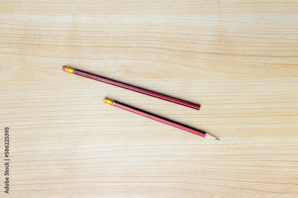 Obraz premium A photo of pencils isolated on wooden background, after some edits.