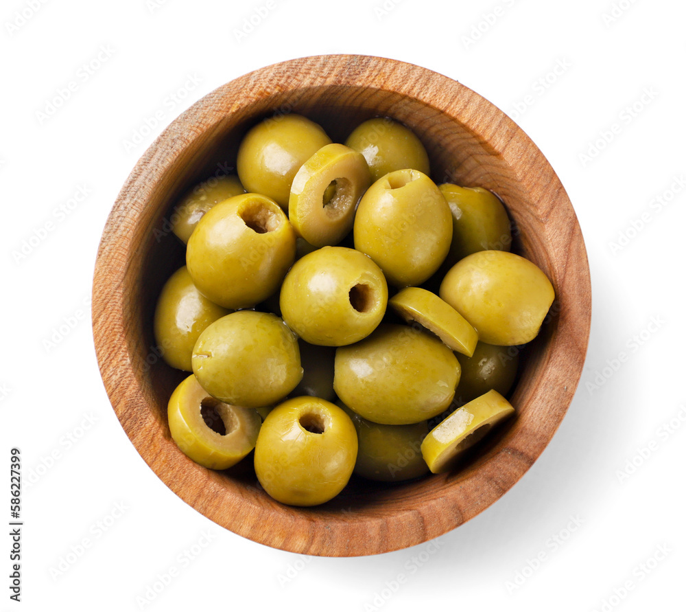 Green olives in a wooden plate close-up on a white. Top view Green olives in a wooden plate close-up on a white. Top view
