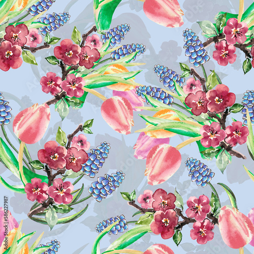 Spring seamless pattern from tulips, sakura and muscari on blue background. Composition for spring fabrics and celebration papers. 
