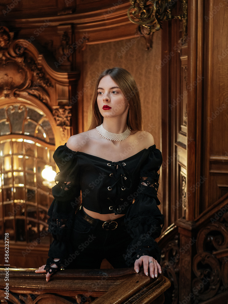 Elegant lady in black shirt on old architecture background with nature light