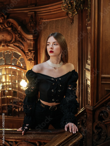 Obraz na płótnie Elegant lady in black shirt on old architecture background with nature light w salonie