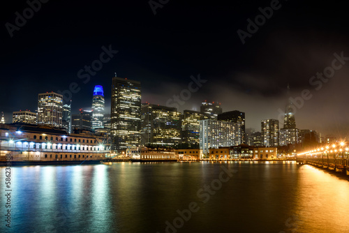 San Francisco financial district skyline as seen from pier seven on a foggy autumn night