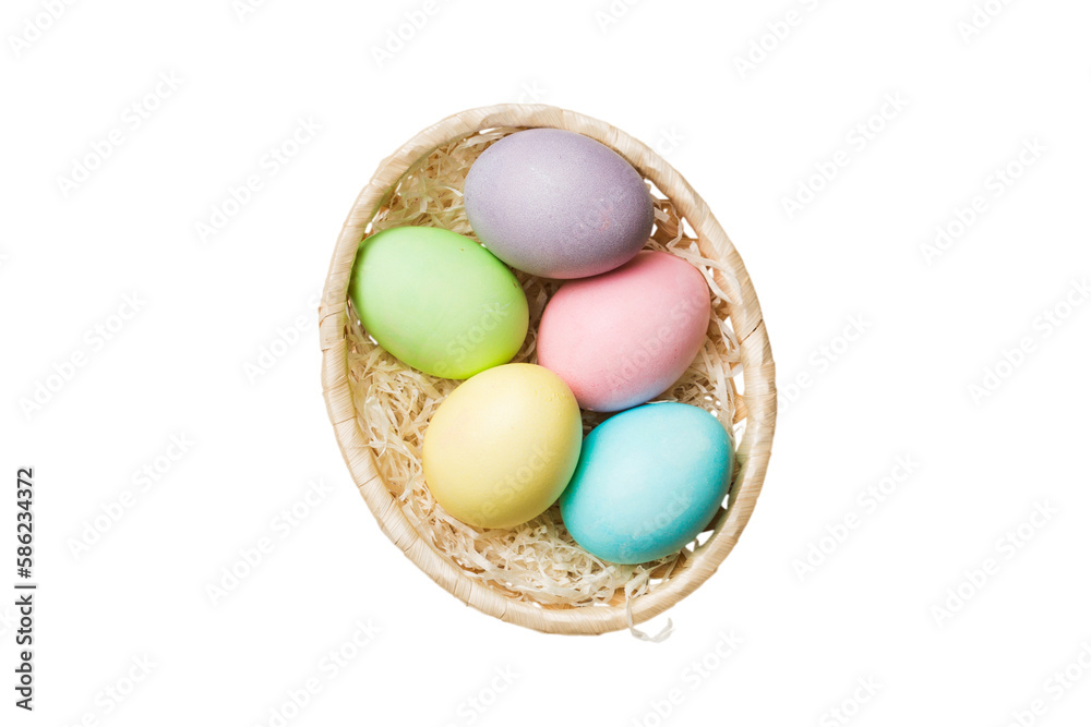 Basket of colorful Easter eggs isolated on white background. Easter basket filled with colored eggs top view holiday concept Basket of colorful Easter eggs isolated on white background. Easter basket filled with colored eggs top view holiday concept