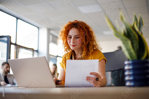 Businesswoman using laptop photo