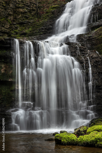 Beautiful British countryside waterfall in full flow; Scaleber Force, Yorkshire Dales National Park, UK.