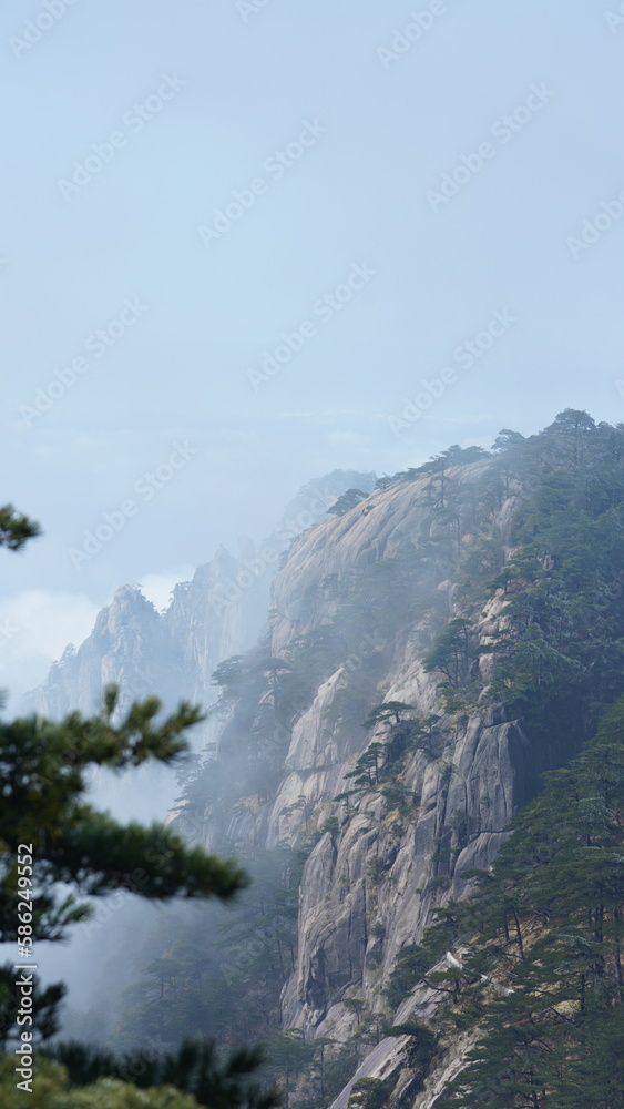 The beautiful mountains landscapes with the green forest and the erupted rock cliff as background in the countryside of the China The beautiful mountains landscapes with the green forest and the erupted rock cliff as background in the countryside of the China
