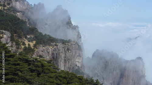 The beautiful mountains landscapes with the green forest and the erupted rock cliff as background in the countryside of the China © Bo