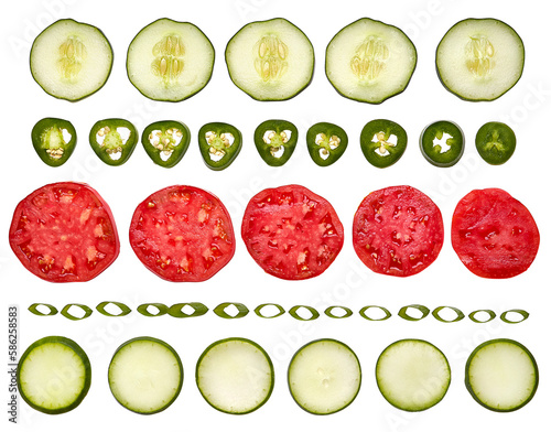 Pattern of sliced vegetables on a white background. Food ingredients. Tomatos, cucumbers, jalapenos, green onion, zucchini. No background.