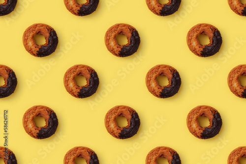 オールドファッション ドーナッツ チョコレート 黄色背景 シームレス パターン