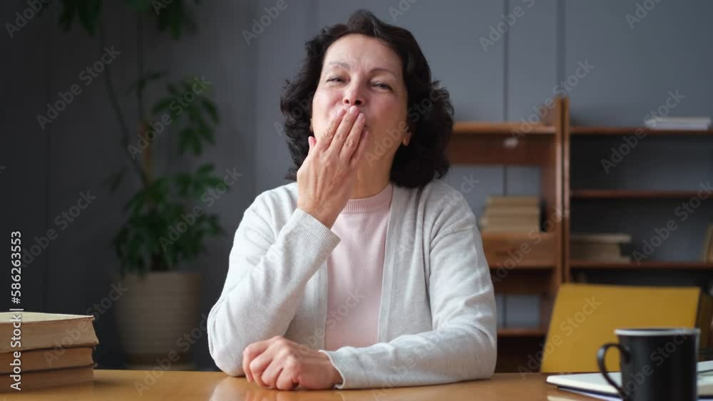 Happy middle aged senior woman talk on video call with friends family. Laughing mature old senior grandmother having fun speaking with grown up children online. Headshot portrait selfie webcamera view Happy middle aged senior woman talk on video call with friends family. Laughing mature old senior grandmother having fun speaking with grown up children online. Headshot portrait selfie webcamera view