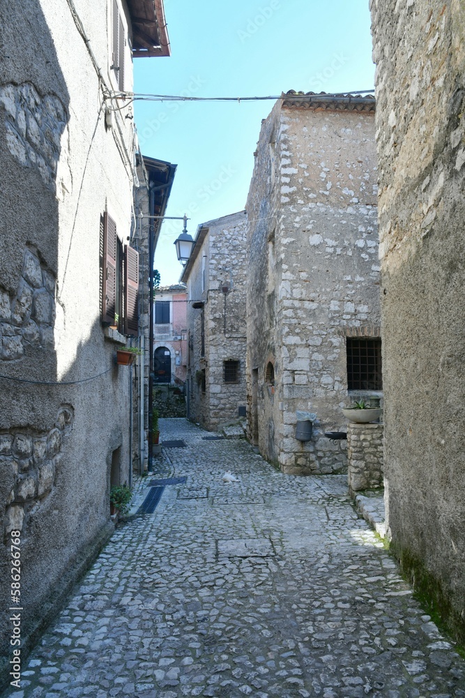 A narrow street among the old houses of Fumone, a historic town in the state of Lazio in Italy.