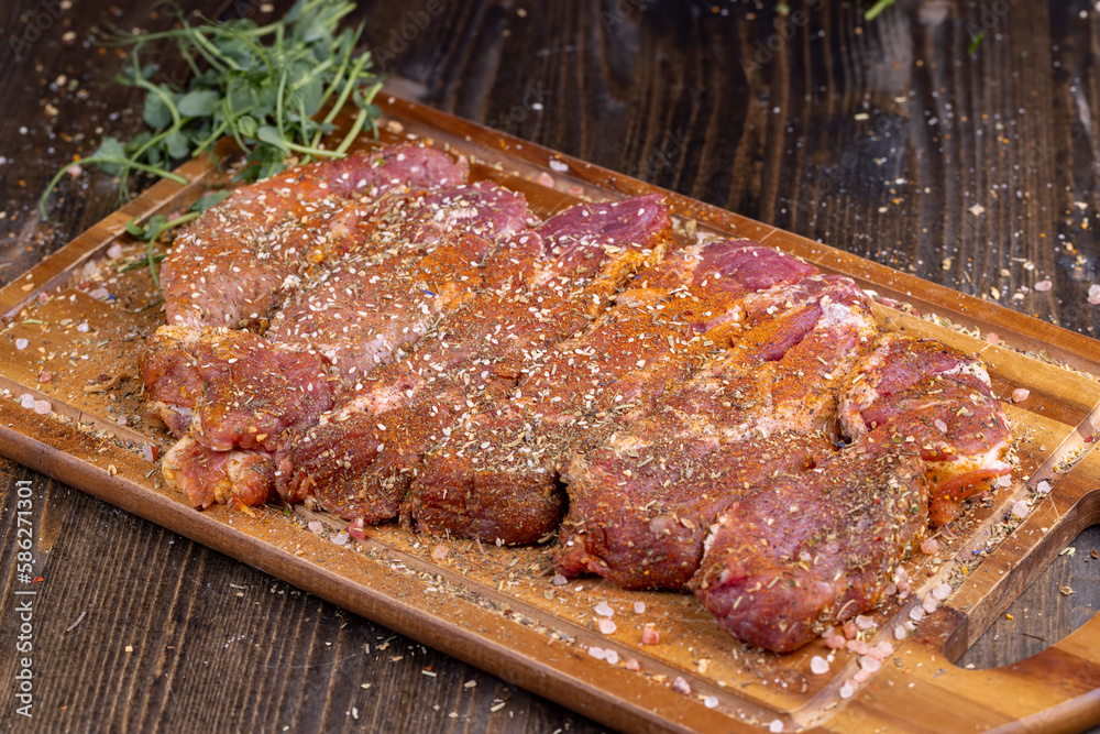 Pork meat pieces marinated with spices and salt Pork meat pieces marinated with spices and salt