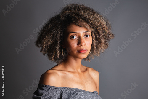 Young Brazilian black woman, posing for photos, black militancy. Fight against racism and prejudice. photo