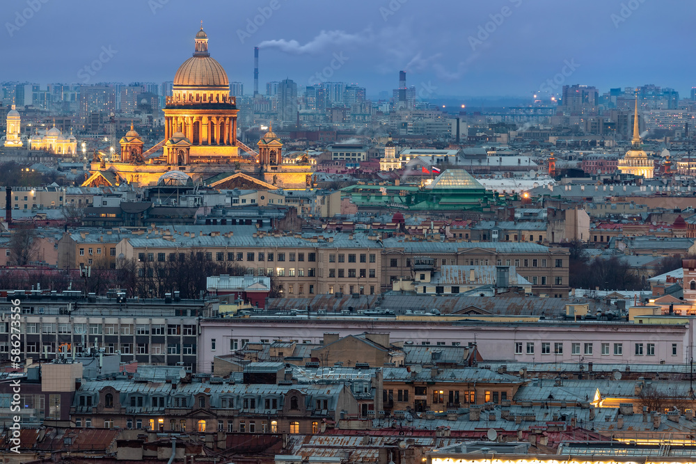 view of St. Isaac's Cathedral and the historic city center in St. Petersburg in the evening, cityscape, illumination, sunset