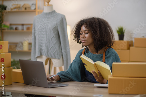 Young African American woman and online selling at home office, Startup small business owner working Online selling and product order for delivery to customer.