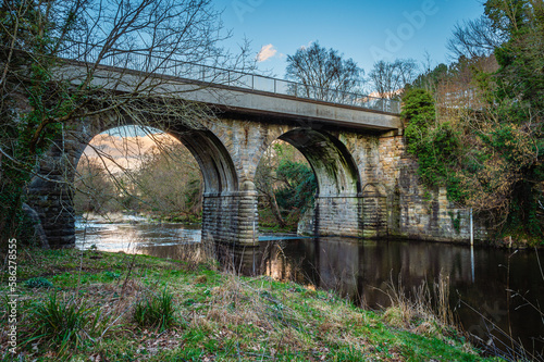 Derwent Road Bridge above River Derwent, formed by the meeting of two burns in the North Pennines and flows between the boundaries of Durham and Northumberland as a tributary of the River Tyne photo