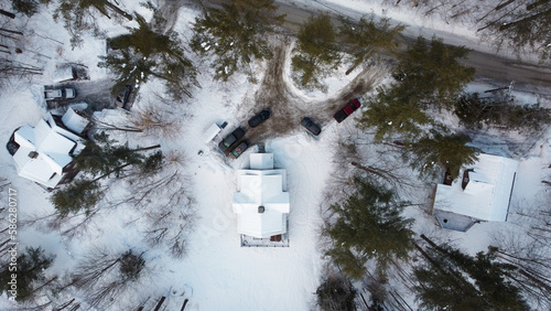 Sunrise over snow-covered homes in Ludlow, Vermont  photo