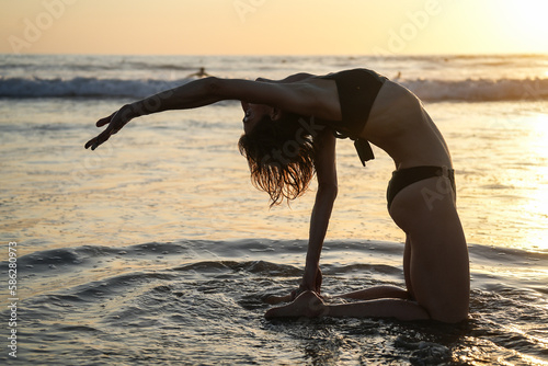 Silhouette sunset golden hour woman yoga meditation meditating asana Costa Rica beautiful lifestyle fun beach 