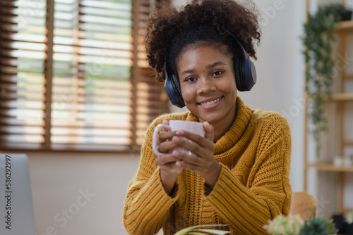 Young African American businesswoman studying or working at home.