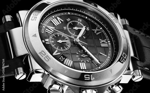 Dark hours. Luxury Men's Wrist Watch on a black background.