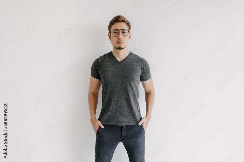 Cool and serious colored hair Asian man in black t-shirt isolated on white. Cool and serious colored hair Asian man in black t-shirt isolated on white.