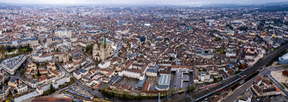 Aerial around the old town of the city Dijon in France on a cloudy morning in late winter