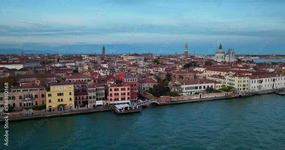 Aerial view of Venice, Italy. Canals and gondolas on lagoon. Panorama City skyline during summer sunset over buildings and Basilica's Aerial view of Venice, Italy. Canals and gondolas on lagoon. Panorama City skyline during summer sunset over buildings and Basilica's