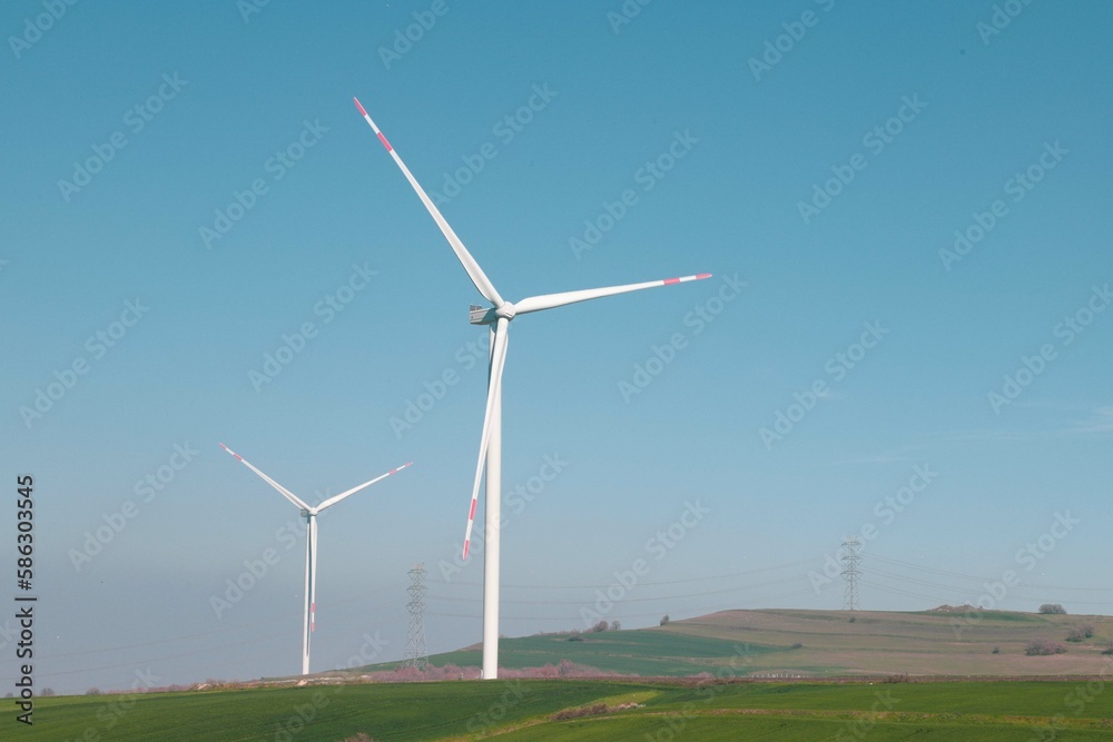 Wind turbine and windmill. Clean energy in green nature in different locations. Sustainability and environment concept
Wind turbine and windmill. Clean energy in green nature in different locations. Sustainability and environment concept