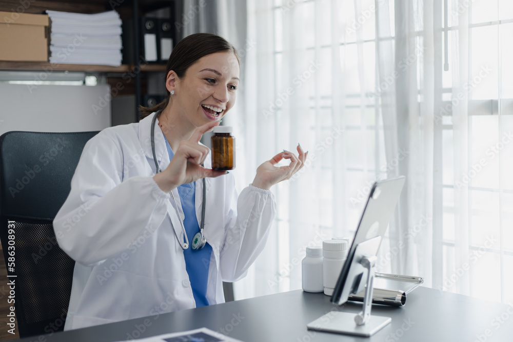 Female doctor working at office desk with laptop computer. Female doctor working at office desk with laptop computer.