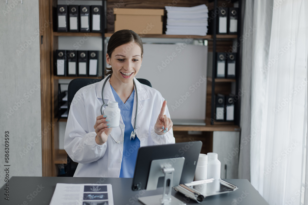 Doctor woman and stethoscope with medicine pills on desk. healthcare and medical concepts.