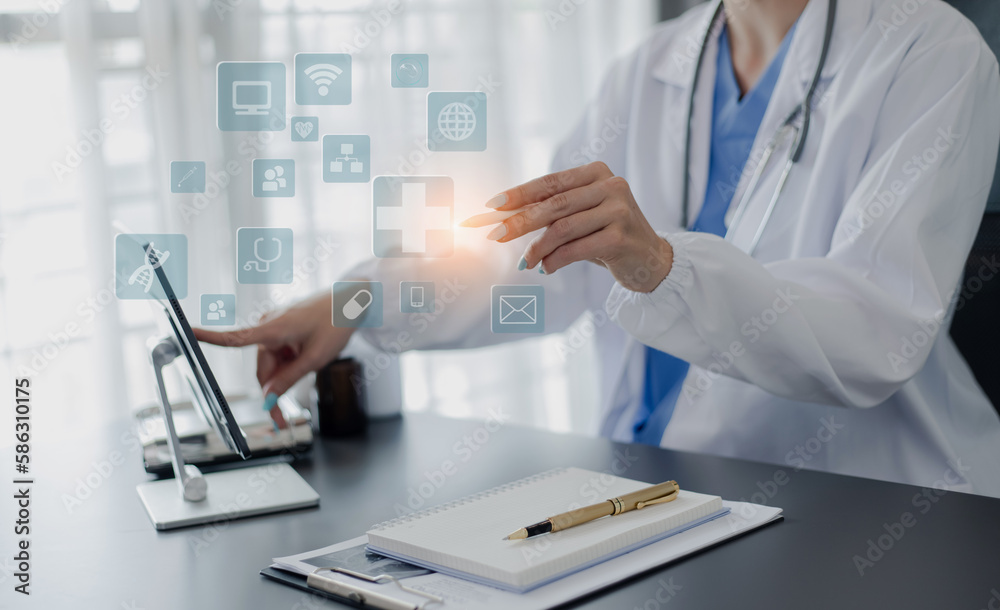 Medicine doctor touching on digital tablet and hologram modern virtual screen interface icons, Medical technology and futuristic concept. Medicine doctor touching on digital tablet and hologram modern virtual screen interface icons, Medical technology and futuristic concept.