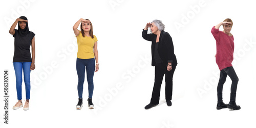 group of women standing and looking away with hand on forehead on white background