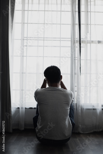 Sad young man in the bedroom, People with depression concept. 