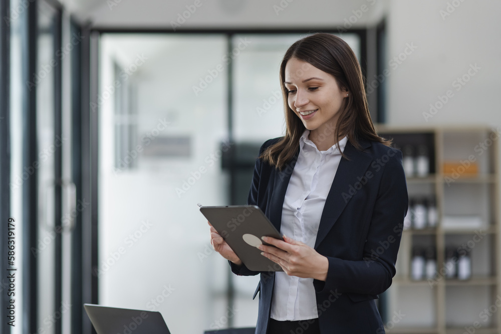 businesswoman using digital tablet at office workplace. businesswoman using digital tablet at office workplace.