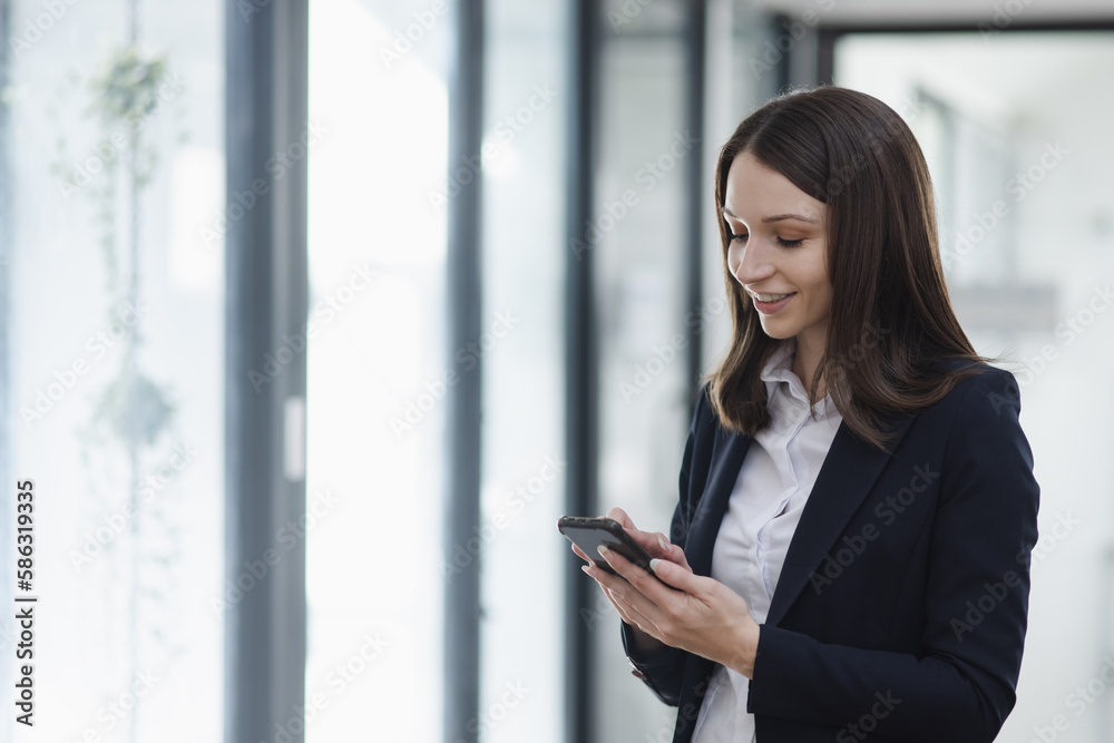 Young business woman using smartphone in the office, Business person and technology, Female using mobile phone, Young business woman using smartphone in the office, Business person and technology, Female using mobile phone,