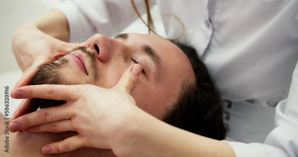 Portrait of relaxing massage of the head and neck for man at beautician office Portrait of relaxing massage of the head and neck for man at beautician office
