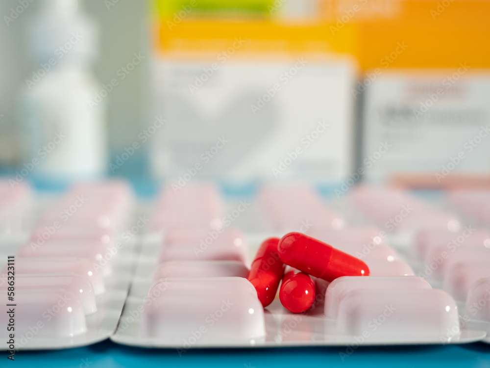 Red medical capsules. Capsules in a blister pack. Close-up.